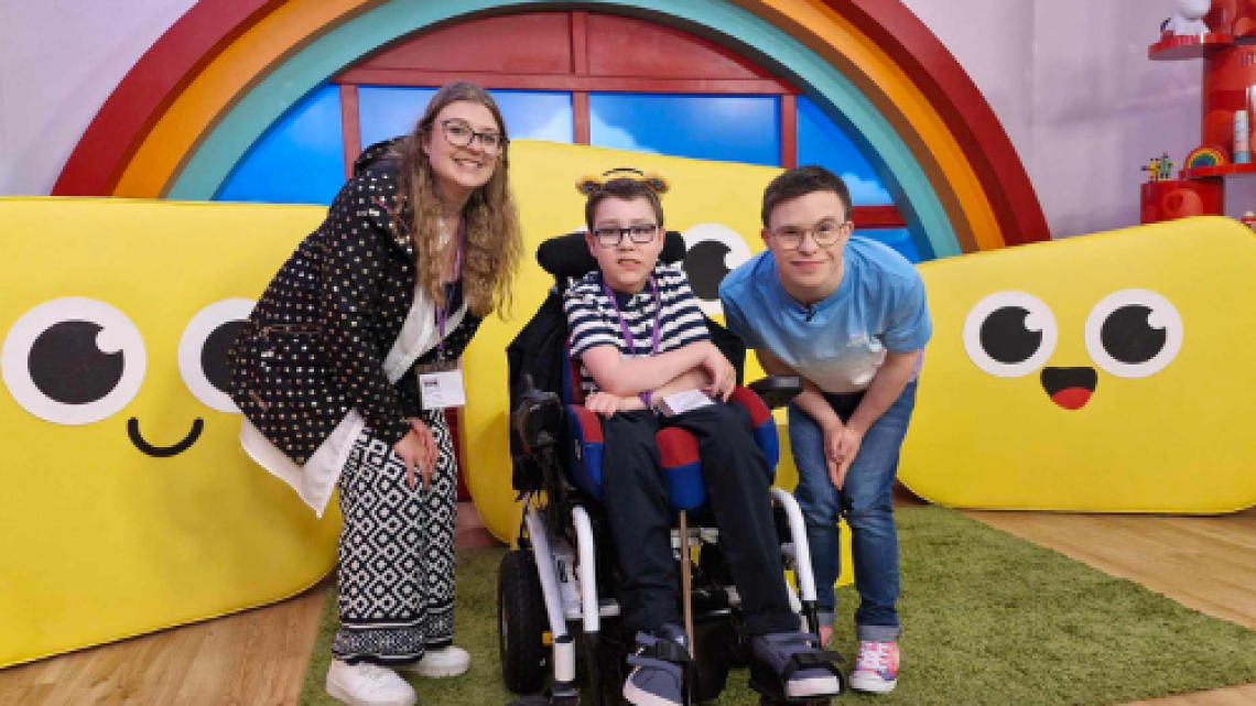 Lora and Phoenix with CBeebies presenter George Webster