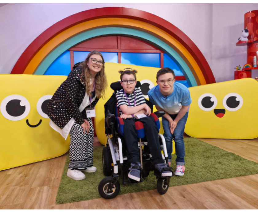 Lora and Phoenix with CBeebies presenter George Webster