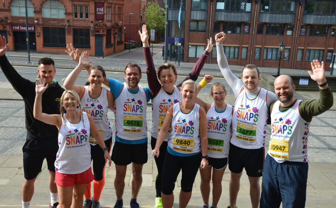 A group of runners celebrating at the Leeds half marathon