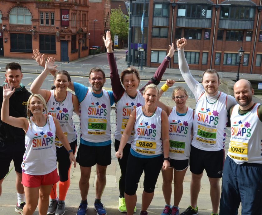 A group of runners celebrating at the Leeds half marathon